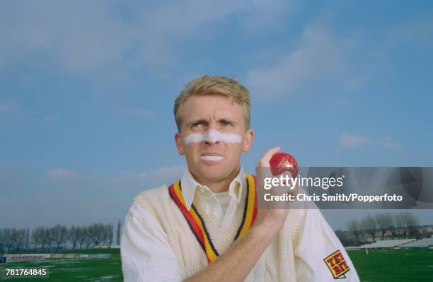 English cricketer Dominic Cork of England and Derbyshire, posed holding a cricket ball circa 1995.