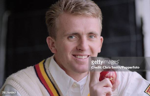 English cricketer Dominic Cork of England and Derbyshire, posed holding a cricket ball circa 1995.