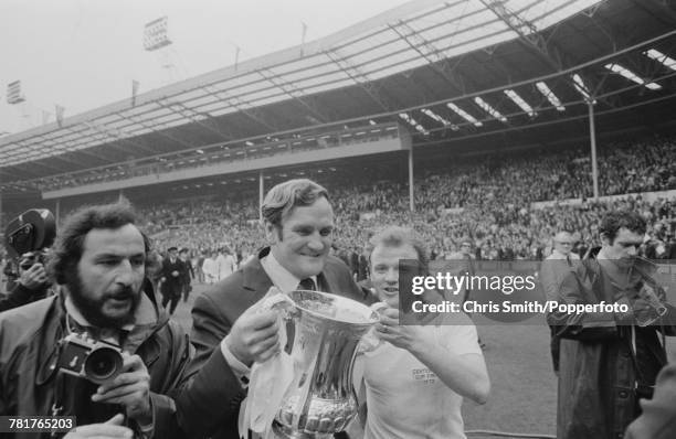 Leeds United manager Don Revie and captain Billy Bremner hold the trophy aloft after Leeds United beat Arsenal 1-0 to win the 1972 FA Cup Final at...