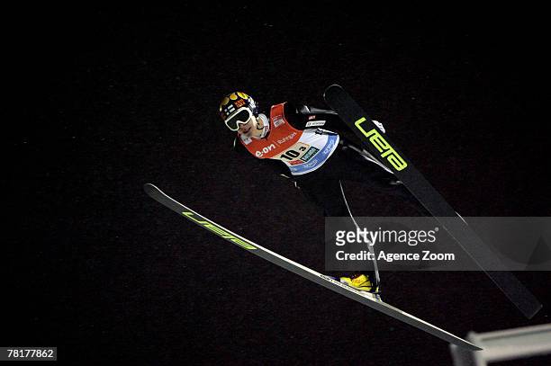 Arttu Lappi of Finland takes third place during the FIS Ski Jumping World Cup Team HS 142 event on November 30, 2007 Kuusamo, Finland.