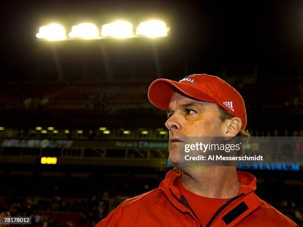 Coach Steve Kragthorpe of the Louisville Cardinals directs play against the University of South Florida Bulls at Raymond James Stadium on November...