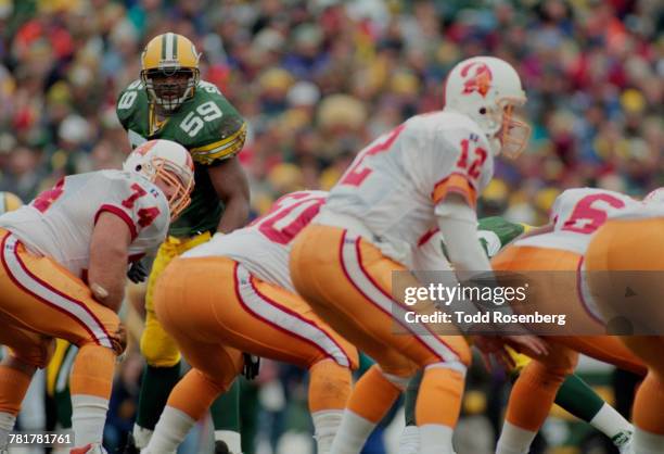 Wayne Simmons, Linebacker for the Green Bay Packers looks directly at Trent Dilfer, Quarterback for the Tampa Bay Buccaneers as he calls the play on...