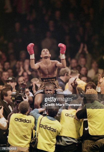 Naseem Hamed celebrates defeating Tom Johnson of the United States to retain his World Boxing Organization featherweight title and winning the...