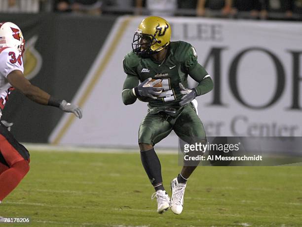 Defensive back Mike Jenkins of the University of South Florida Bulls returns a kick against the Louisville Cardinals at Raymond James Stadium on...