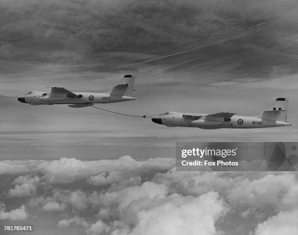 Flight of Vickers Valiant jet bombers of 214 Squadron Royal Air Force practice in flight re-fuelling over the Sahara whilst on their 6,060 mile non...