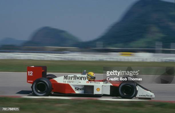 Brazilian racing driver Ayrton Senna drives the Honda Marlboro McLaren McLaren MP4/4 Honda RA168E 1.5 V6t in the 1988 Brazilian Grand Prix at the...