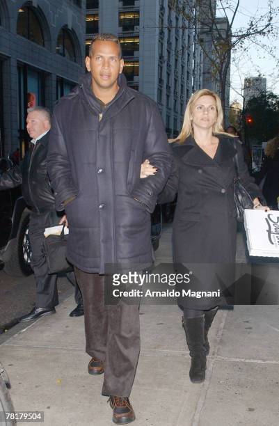 Third Baseman for the New York Yankees Alex Rodriguez and wife Cynthia Scurtis walk down the street after leaving Serafina November 30, 2007 in New...