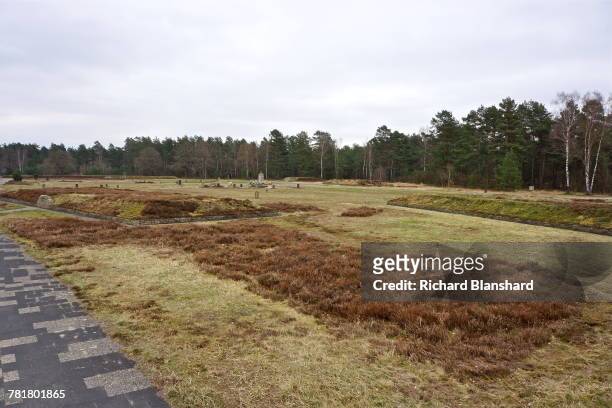 Raised mounds marking some of the thirteen mass graves at the site of the former Bergen-Belsen German Nazi concentration camp in Lower Saxony,...
