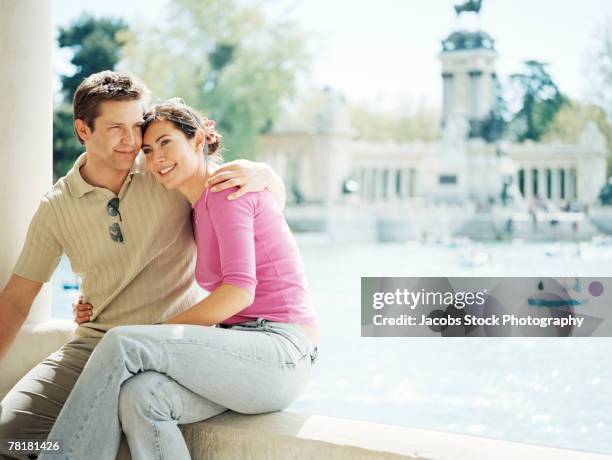 couple sitting together - parque del buen retiro bildbanksfoton och bilder