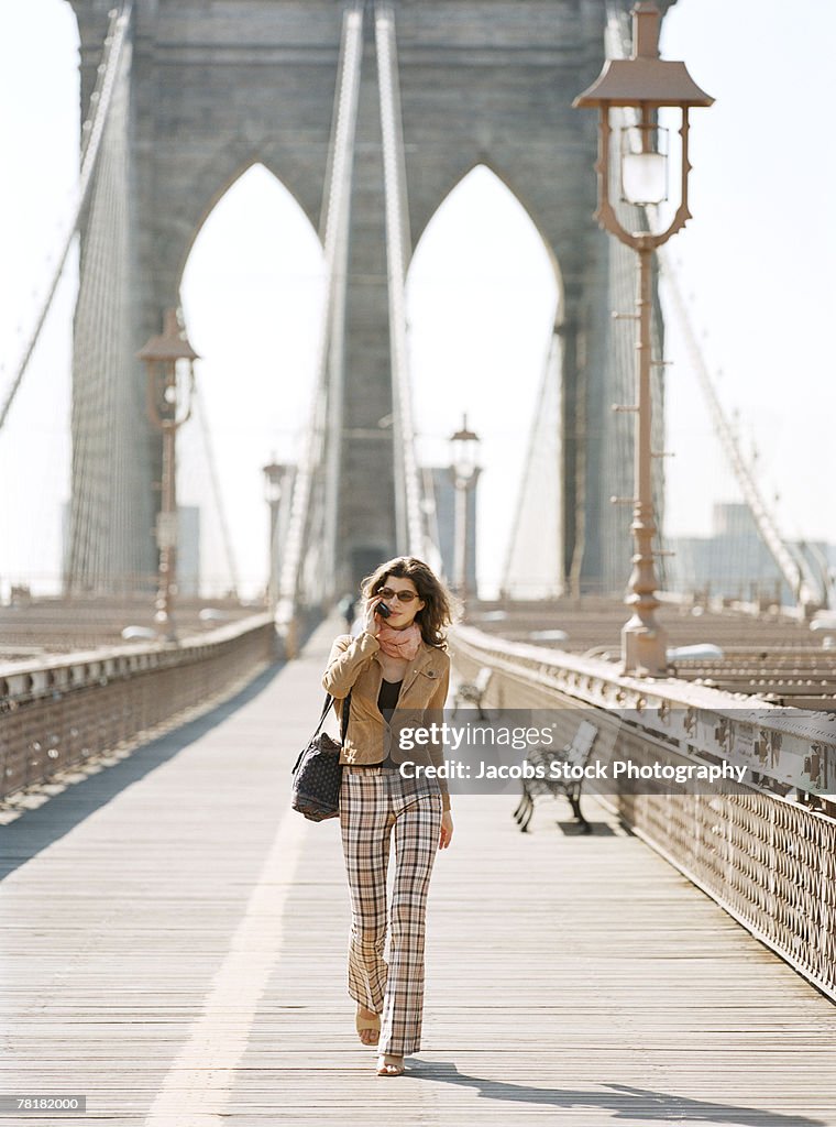 Woman walking on bridge