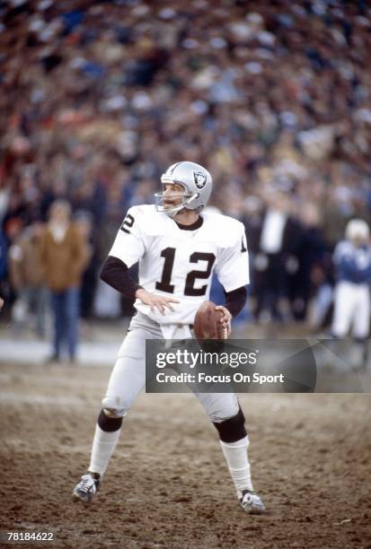 S: Quarterback Ken Stabler of the Oakland Raiders drops back to pass against the Baltimore, Colts during a mid circa 1970's NFL football game at...