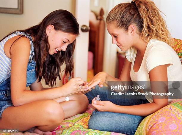 teenage girls painting fingernails - pubescent girl stock pictures, royalty-free photos & images