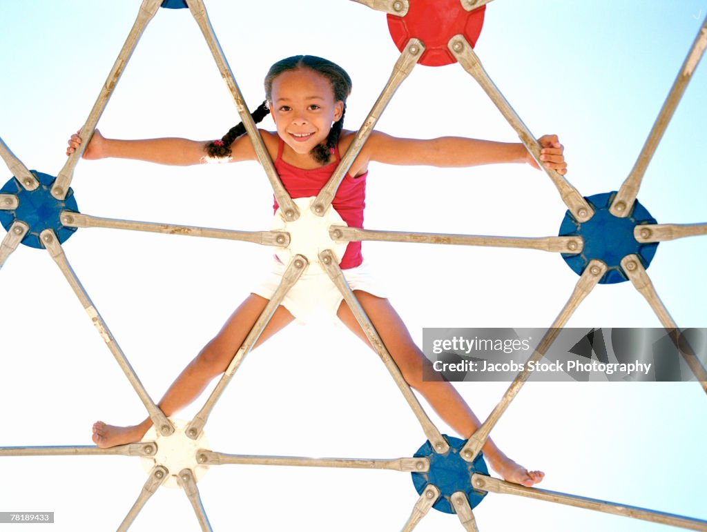 Girl on jungle gym
