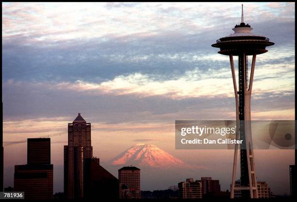 The Seattle Space Needle is viewed during dusk with Mt. Rainier in the background May 30, 2000 in Seattle, WA.