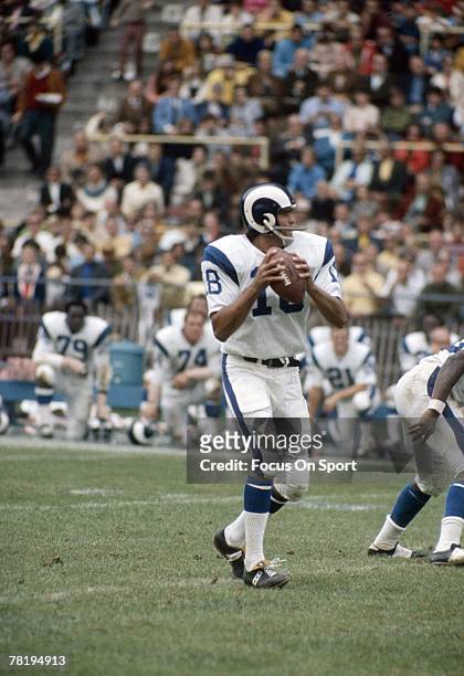 S: Quarterback Roman Gabriel of the Los Angeles Rams drops back to pass against the New York Giants during a mid circa 1960's NFL football game at...