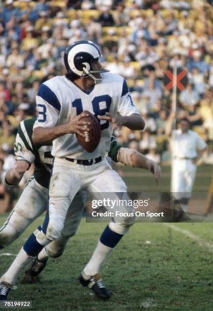S: Quarterback Roman Gabriel of the Los Angeles Rams drops back to pass against the New York Jets during a early circa 1970's NFL football game at...