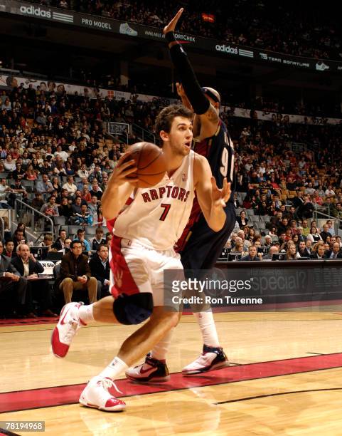 Andrea Bargnani of the Toronto Raptors drives past Drew Gooden of the Cleveland Cavaliers at the Air Canada Centre November 30, 2007 in Toronto,...