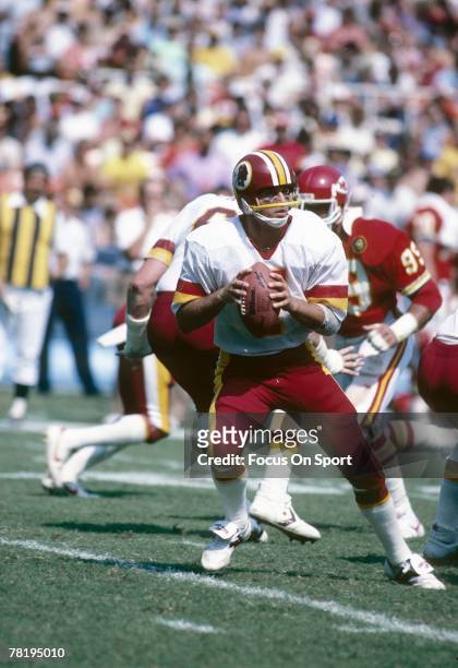 S: Quarterback Joe Theismann of the Washington Redskins drops back to pass against the Kansas City Chiefs during a late circa 1970's NFL football...