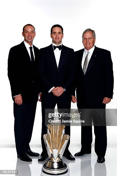 Crew chief Chad Knaus, poses with Jimmie Johnson, the 2006 NASCAR Nextel Cup Series Champion, and Team owner Rick Hendrick with the Nextel Cup...