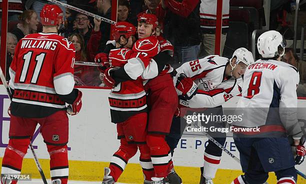 Rod Brind Amour of the Carolina Hurricanes celebrates with teammates Chad LaRose and Justin Williams after his 2nd goal of the game in the 3rd period...