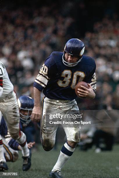 Running back Bill Brown of the Minnesota Vikings carries the ball during a circa late 1960's NFL football game against the Cleveland Browns. Brown...