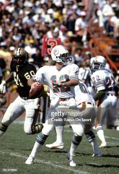 Bob Griese of the Miami Dolphins drops back to pass in a circa mid 1970's NFL game aginst the New Orleans Saints in Miami, Florida. Griese played for...