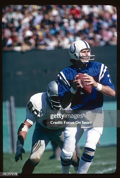 Bert Jones of the Baltimore Colts drops back to pass in a circa mid 1970's NFL game against the Oakland Raiders in Baltimore, Maryland. Jones played...