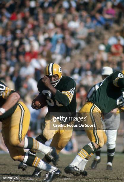 Ben Wilson of the Green Bay Packers carries the ball against the Kansas City Chiefs during Super Bowl I on January 15, 1967 at the Memorial Coliseum...