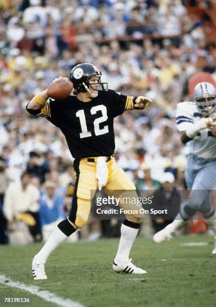 Terry Bradshaw of the Pittsburgh Steelers throws a pass against the Dallas Cowboys during Super Bowl XIII on January 21, 1979 at the Orange Bowl in...