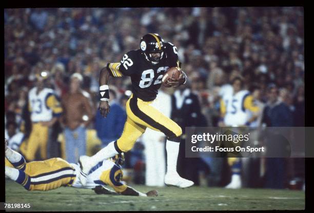 John Stallworth of the Pittsburgh Steelers breaks free and heads for the goal line during Super Bowl XIV against the Los Angeles Rams on January 20,...