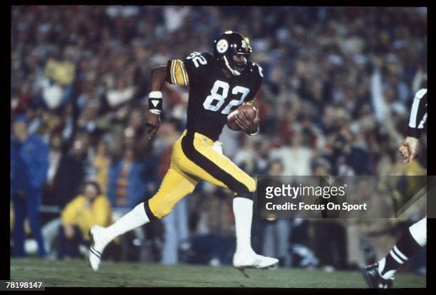 John Stallworth of the Pittsburgh Steelers breaks free and heads for the goal line during Super Bowl XIV against the Los Angeles Rams on January 20,...