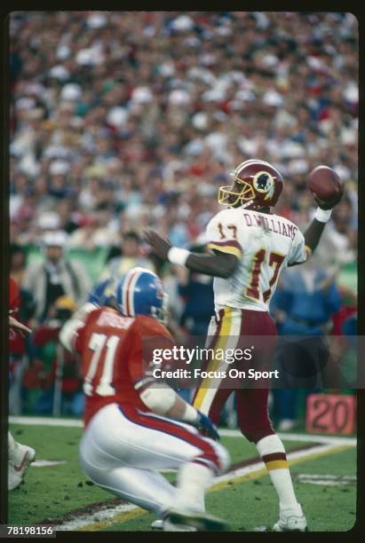 Doug Williams of the Washington Redskins throws a pass against the Denver Broncos during Super Bowl XXII on January 25, 1988 at Jack Murphy Stadium...