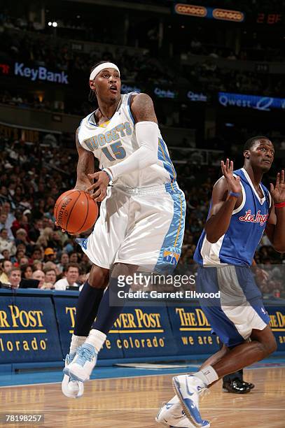 Carmelo Anthony of the Denver Nuggets goes to the basket against the Los Angeles Clippers at the Pepsi Center November 30, 2007 in Denver, Colorado....