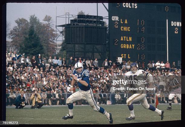 S: Wide Receiver Raymond Berry of the Baltimore Colts chases after a pass in front of a Minnesota Vikings defender during a circa 1960's NFL football...