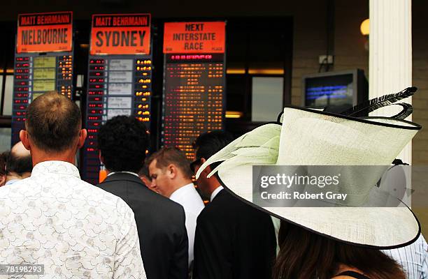 Punters look to put bets on during the 1st Randwick race meeting since the Equine Influenza held at Royal Randwick on December 1, 2007 in Sydney,...