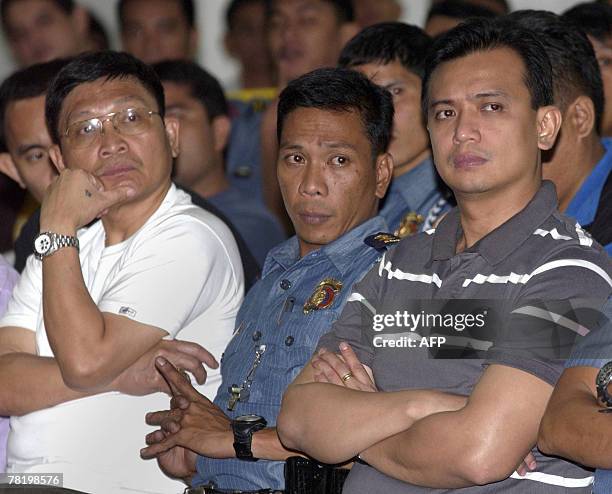 Arrested Senator Antonio Trillanes and army Brigadier General Danilo Lim leaders of a group of renegade soldiers who took over a luxury hotel in the...