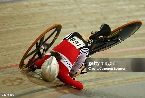 Dana Gloss of Germany falls to the track as her front forks snap off her bicycle frame during the women's team sprint bronze medal race during day...