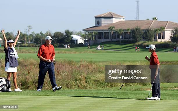 Tom Lehman celebrates with his wife Melissa Lehman as they watch his son Thomas Lehman make a long biride putt at the 1st hole during the first round...