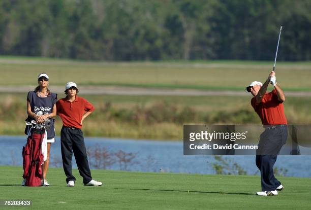 Tom Lehman is watched by his son Thomas Lehman and his wife Melissa Lehman as he hits on the 1st hole during the first round of the 2007 Del Webb...