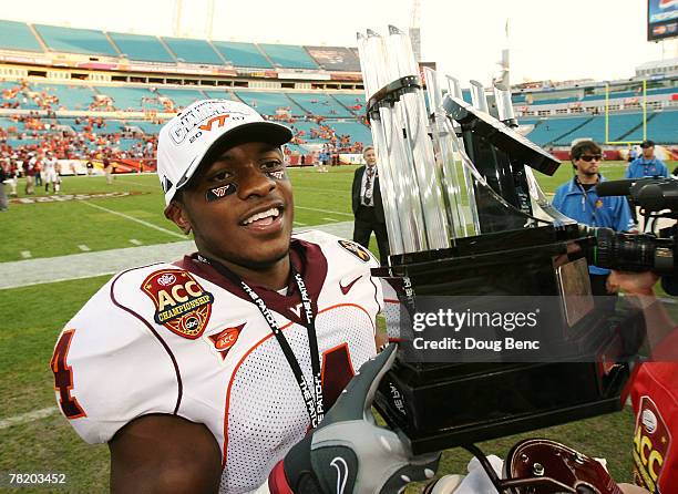 Eddie Royal of the Virginia Tech Hokies celebrates with the ACC Championship trophy after defeating the Boston College Eagles in the ACC Championship...