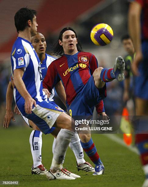 Barcelona's Argentinian Leo Messi vies with Espanyol's Riera and Clemente during their Spanish League football match at the Olympic stadium Lluis...