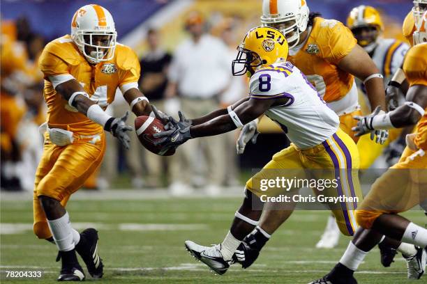 Trindon Holliday of the Louisiana State University Tigers fights for a fumble with Eric Berry of the University of Tennessee Volunteers in the SEC...