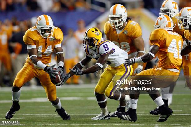 Trindon Holliday of the Louisiana State University Tigers fights for a fumble with Eric Berry of the University of Tennessee Volunteers in the SEC...