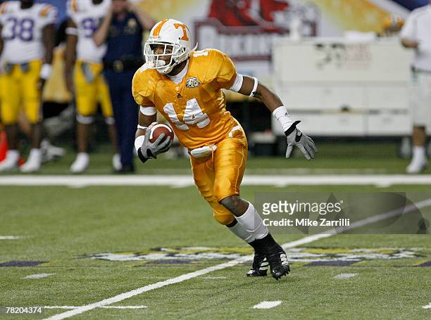 Defensive back Eric Berry of the Tennessee Volunteers makes an interception and runs it upfield during the SEC Championship game against the LSU...