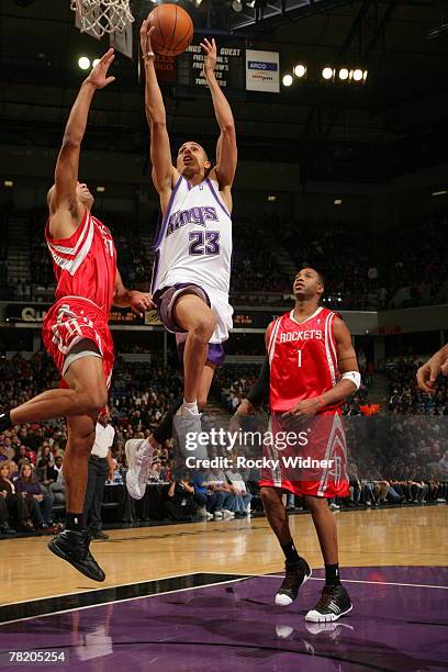 Kevin Martin of the Sacramento Kings takes the ball to the basket against Tracy McGrady of the Houston Rockets on December 1, 2007 at ARCO Arena in...