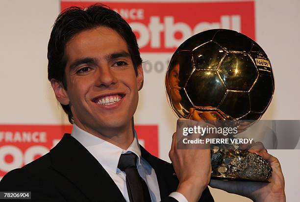 Milan's Brazilian midfielder Kaka poses with his trophy after being awarded as France Football's Player of the Year winning the prestigious Ballon...