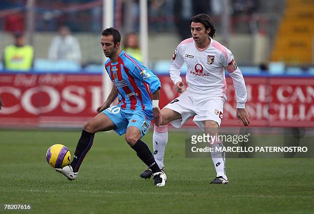 Catania's midfielder Giuseppe Mascara vies with Palermo's defender Andrea Barzagli during their Serie A football match at Massimino Stadium 02...