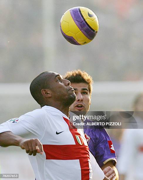 Inter Milan's Brazilian defender Douglas Sisenando Maicon challenges for the ball with Fiorentina's Romanian forward Adrian Mutu during Fiorentina...