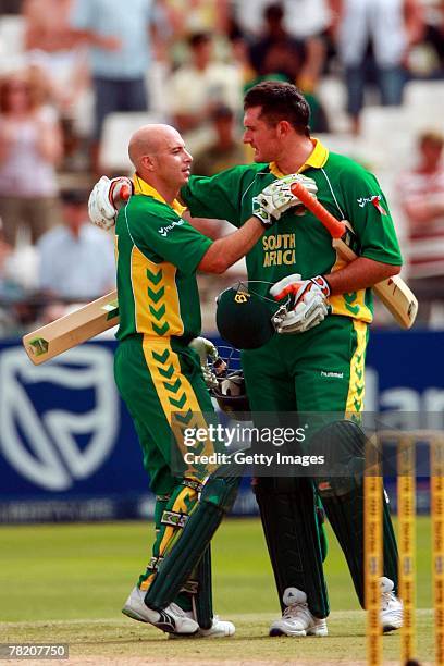 Herschelle Gibss is congratulated by Graeme Smith during the third ODI match between South Africa and New Zealand held at Sahara Park Newlands on...