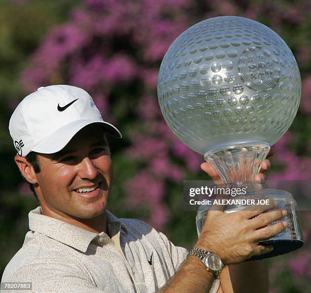 South Africa's Trevor Immelman celebrates winning the 27th edition of the Nedbank Golf Challenge in Sun City, South Africa, 02 December 2007. He...